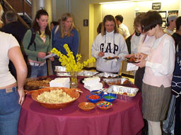 Diane Brousseau samples snacks with Joan Patrick