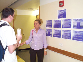 Alison Sikora presents to students and professors Phelan and Sauer