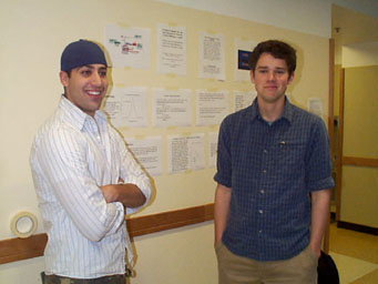 Junior Michael Talmadge presents his physics project to students and Fr. Von Arx